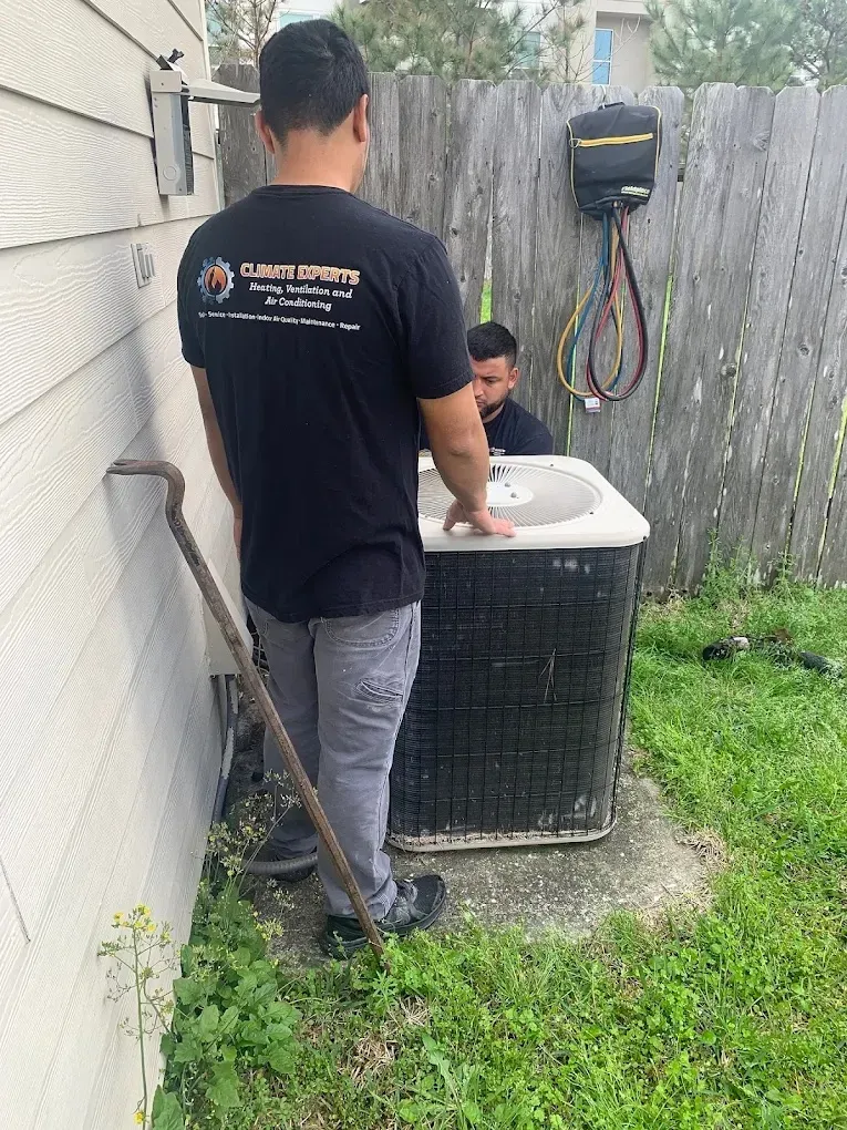 Summer AC Preparation: Essential Checklist for Houston 3 HVAC technician recharging refrigerant in air conditioning unit highlighting professional maintenance benefits